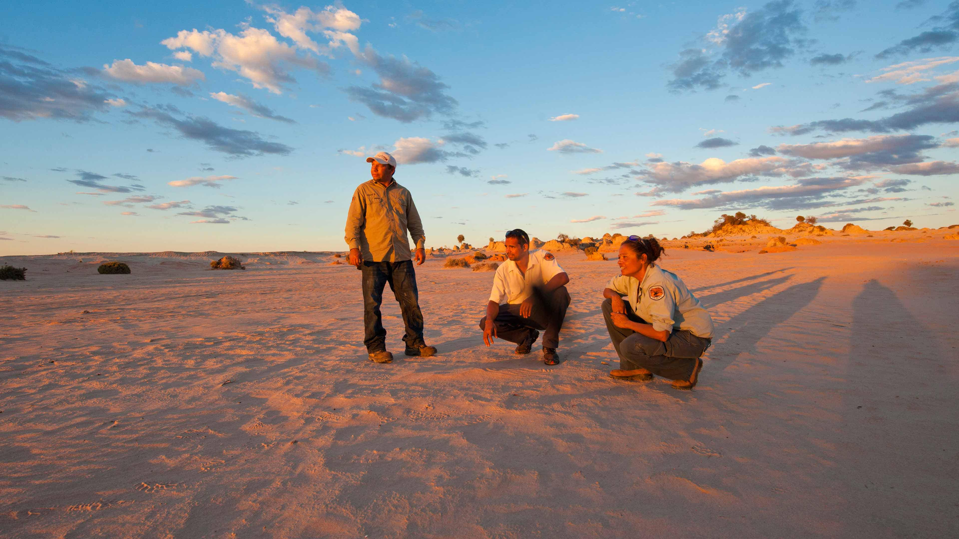 Mungo National Park Discovery Rangers on the Walls of China as the sun sets.