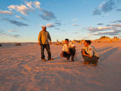 Mungo National Park Discovery Rangers on the Walls of China as the sun sets.