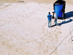 Prior to 3D scanning and LiDAR there was photogrammetry. The blue tent is on wheels and contains a camera array to capture 3D photogrammetry of each individual footprint. In 2005, it took 45 mins per print. Today it takes seconds to capture the hole site. (Image from NPWS)
